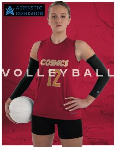 Woman holding volleyball wearing uniform